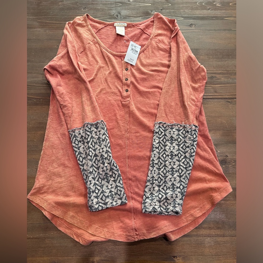 Long sleeve orange shirt with grey on sleeves